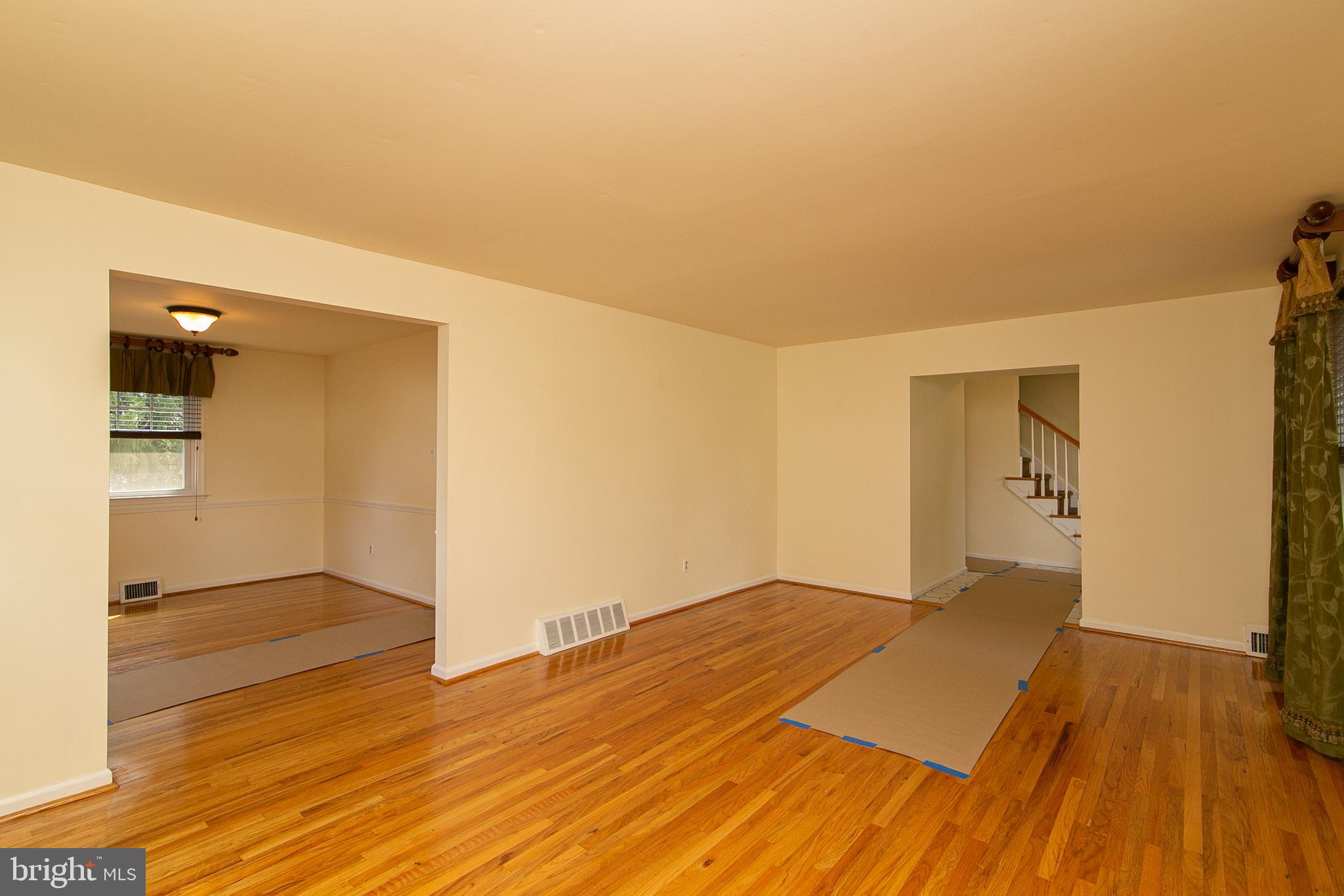 754 West Rolling Road Springfield, PA 19064 - Photo 11 of 53 Large formal living room with custom curtains