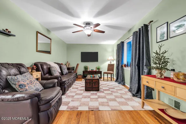 a living room with furniture fireplace and flat screen tv