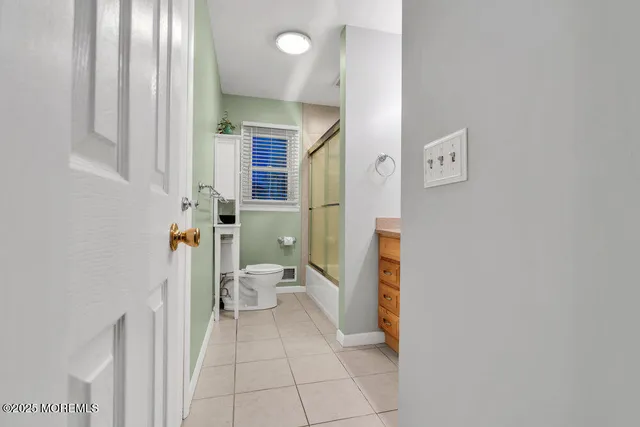a bathroom with a sink and toilet