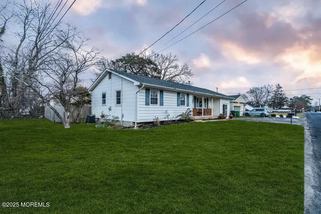 a view of a house with a big yard