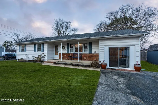 front view of a house with a yard