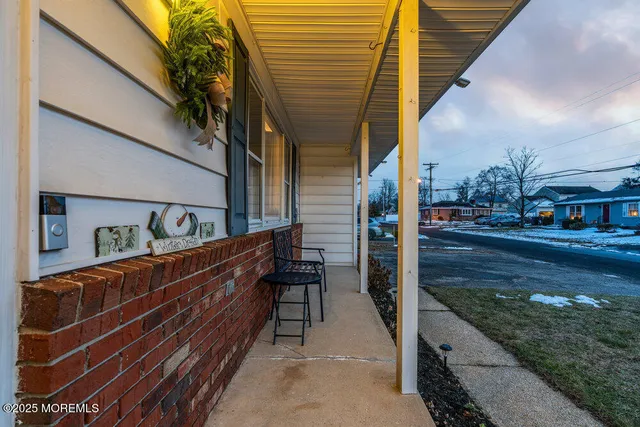 a balcony view with two chairs