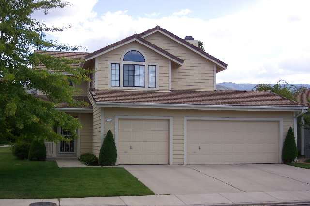 a front view of a house with a garage