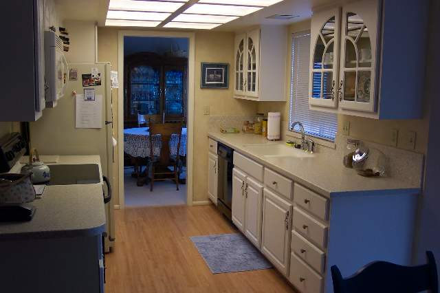 3108 Sweet Clover Street Reno, NV 89509 - Photo 3 of 7 a kitchen with a sink stove and cabinets