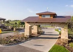 a front view of a house with a garden