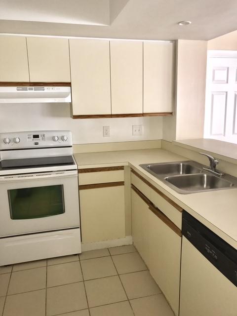 5321 Buckhead Circle Boca Raton, FL 33431 - Photo 12 of 35 a kitchen with a sink stove and cabinets