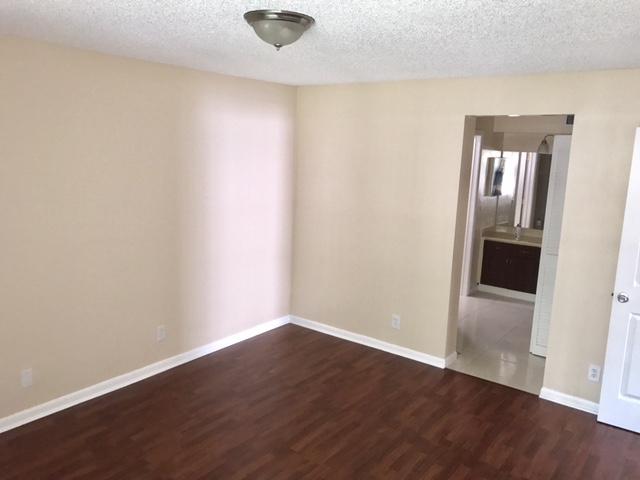 5321 Buckhead Circle Boca Raton, FL 33431 - Photo 13 of 35 an empty room with wooden floor