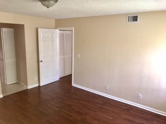 5321 Buckhead Circle Boca Raton, FL 33431 - Photo 14 of 35 an empty room with wooden floor and closet