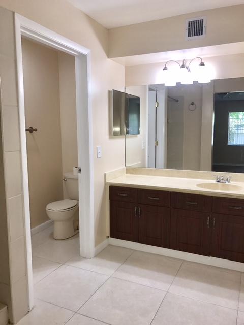 5321 Buckhead Circle Boca Raton, FL 33431 - Photo 16 of 35 a spacious bathroom with a bathtub sink mirror and toilet