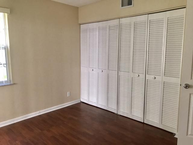 5321 Buckhead Circle Boca Raton, FL 33431 - Photo 20 of 35 an empty room with wooden floor