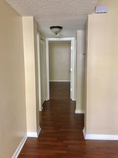 5321 Buckhead Circle Boca Raton, FL 33431 - Photo 22 of 35 a view of a hallway with wooden floor