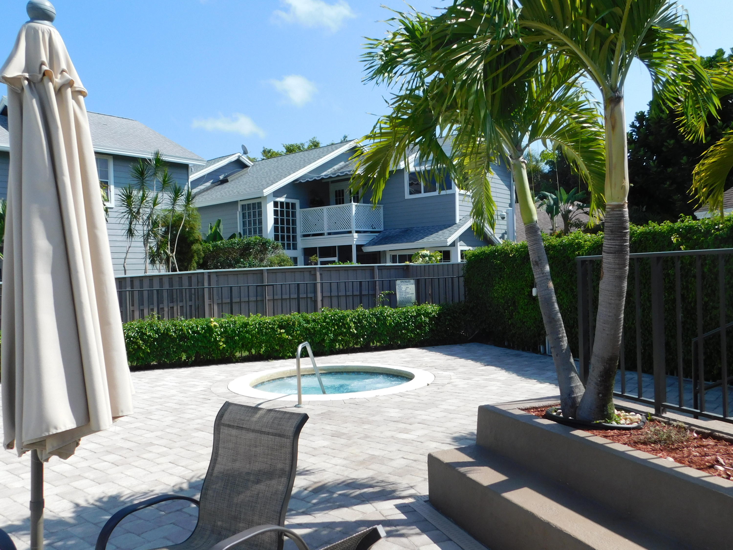 5321 Buckhead Circle Boca Raton, FL 33431 - Photo 30 of 35 a patio with a table and chairs and potted plants