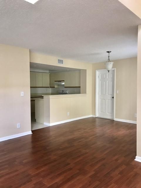 5321 Buckhead Circle Boca Raton, FL 33431 - Photo 9 of 35 a view of a room with wooden floor and a window