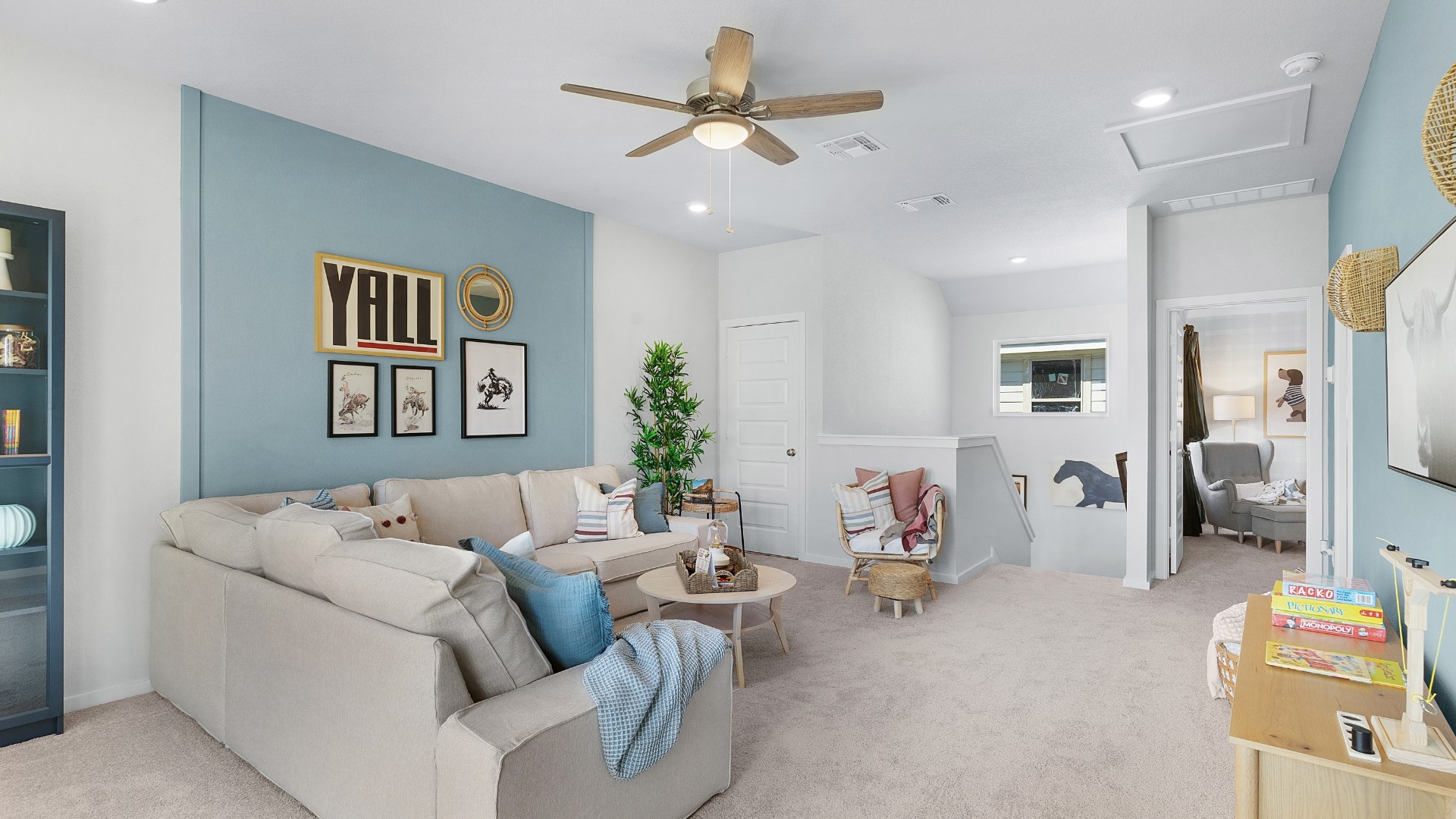 25812 Jasmine Sprig Lane Elgin, TX 78621 - Photo 20 of 33 A versatile secondary living space features a cozy seating area with soft carpeting and gentle recessed lighting.