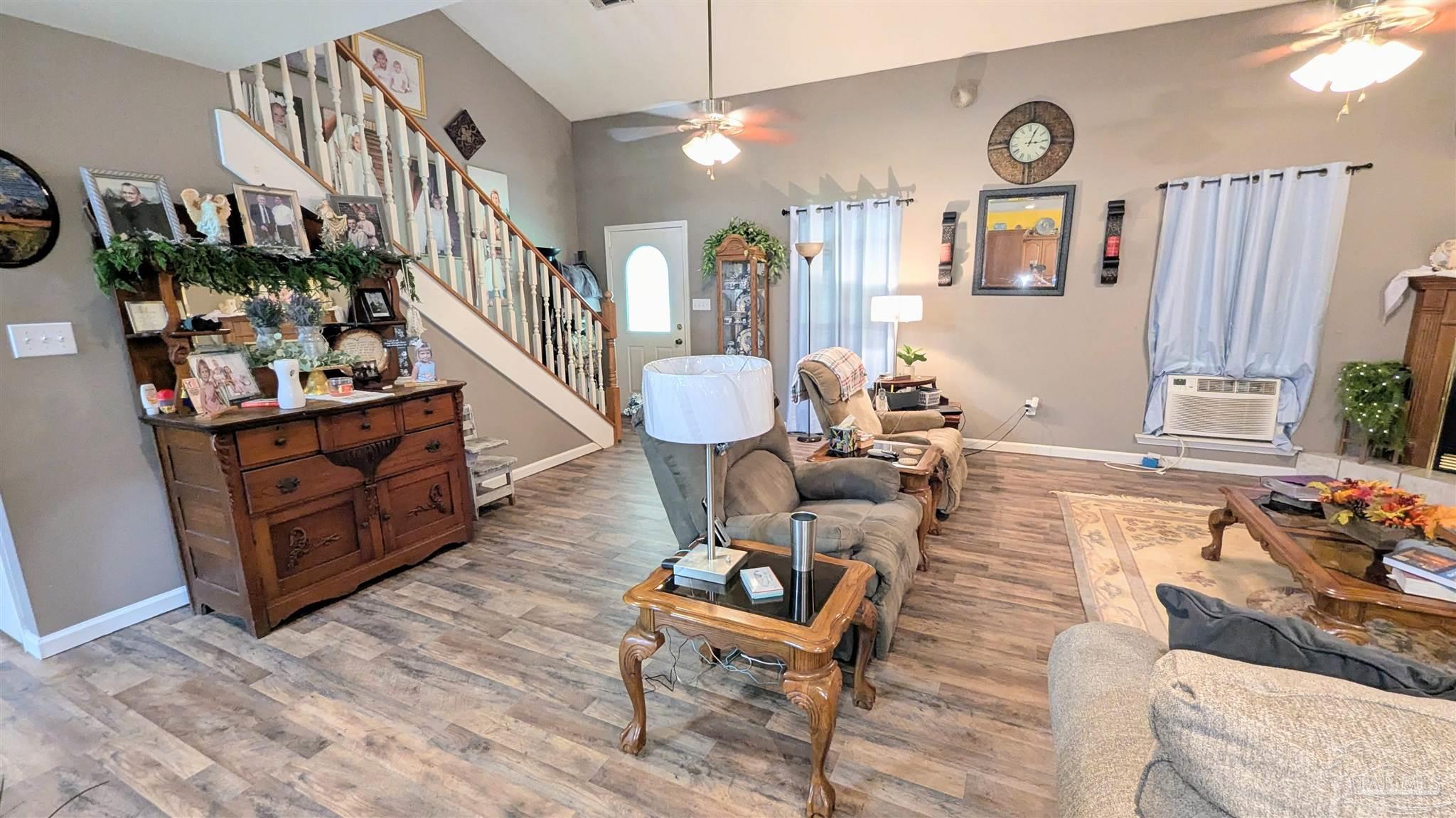 3171 Sam Sullivan Road Millry, AL 36558 - Photo 11 of 72 a living room with furniture and a wooden floor