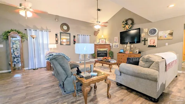 a kitchen with stainless steel appliances kitchen island granite countertop a sink and cabinets