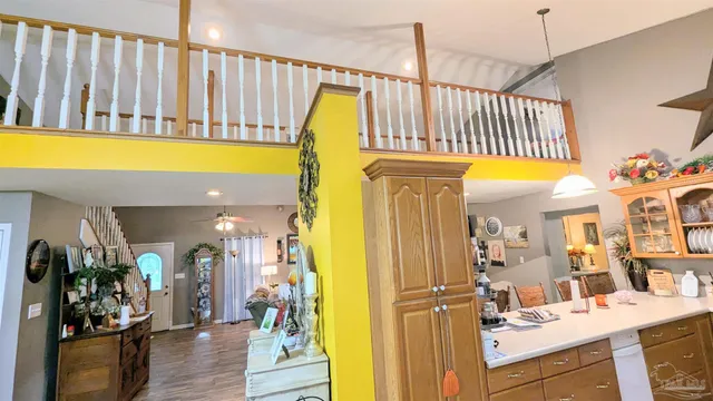 a kitchen with stainless steel appliances granite countertop a stove and a refrigerator