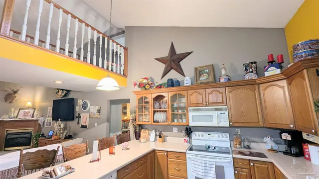 a kitchen with a sink and a stove top oven