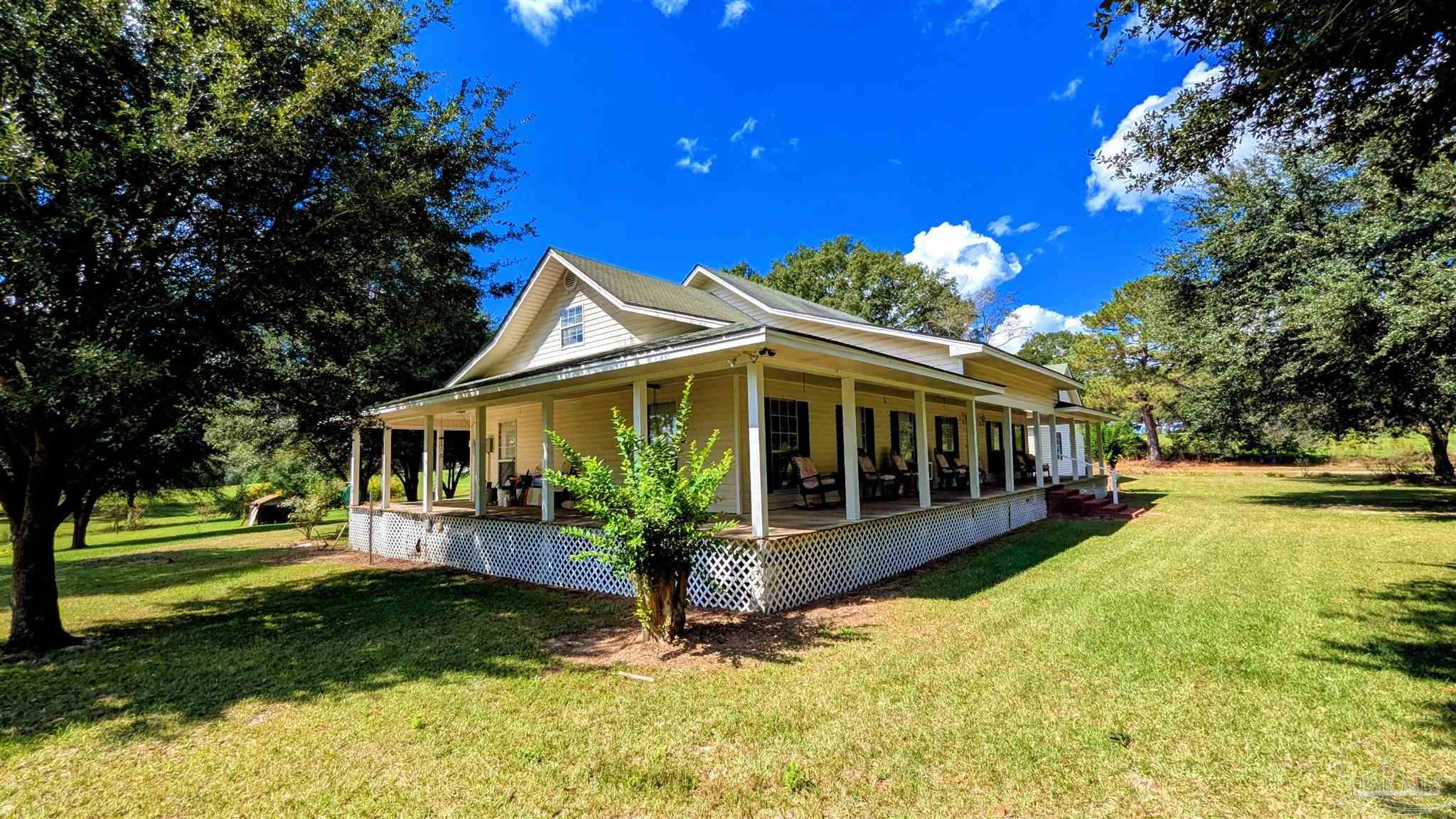 3171 Sam Sullivan Road Millry, AL 36558 - Photo 43 of 72 front view of a house with a yard