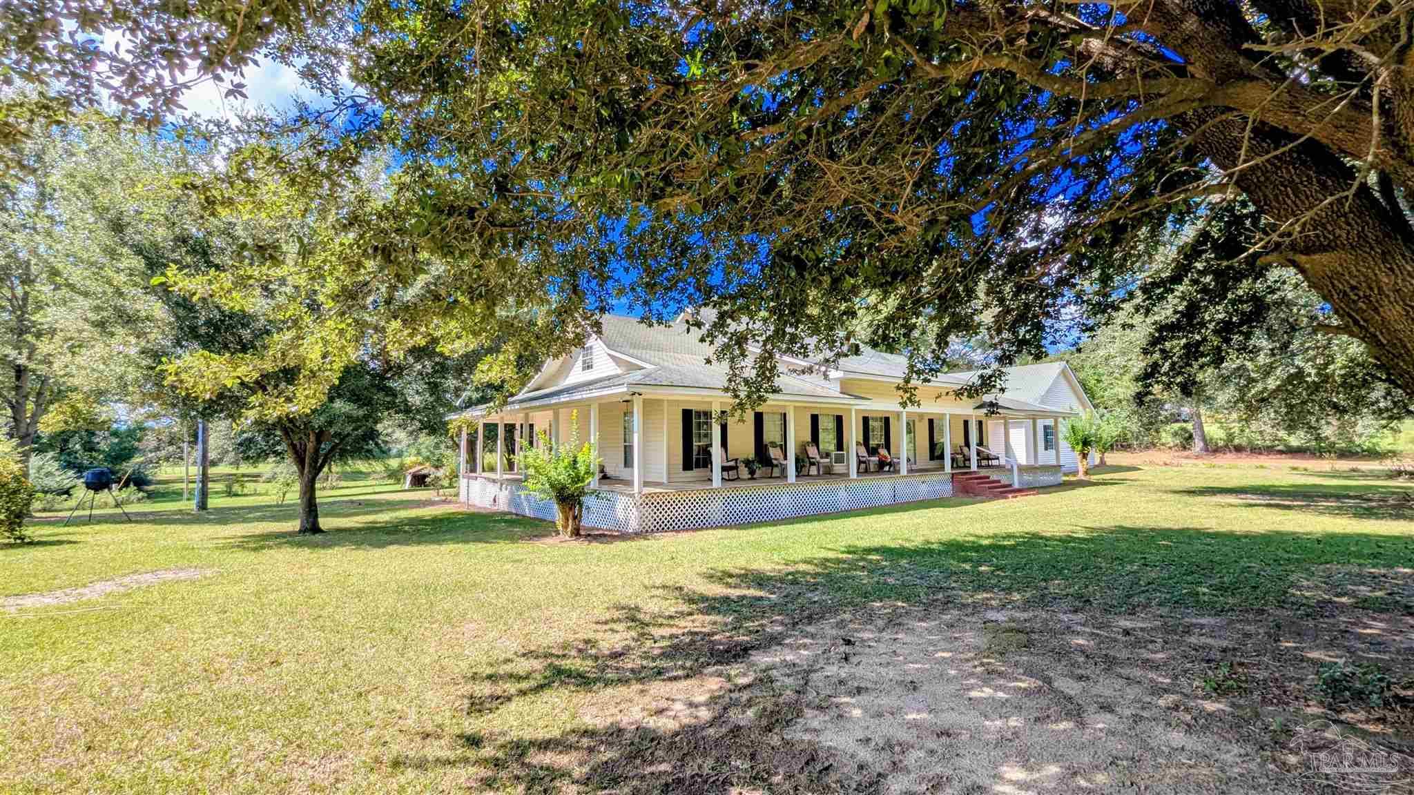 3171 Sam Sullivan Road Millry, AL 36558 - Photo 45 of 72 a front view of a house with a garden