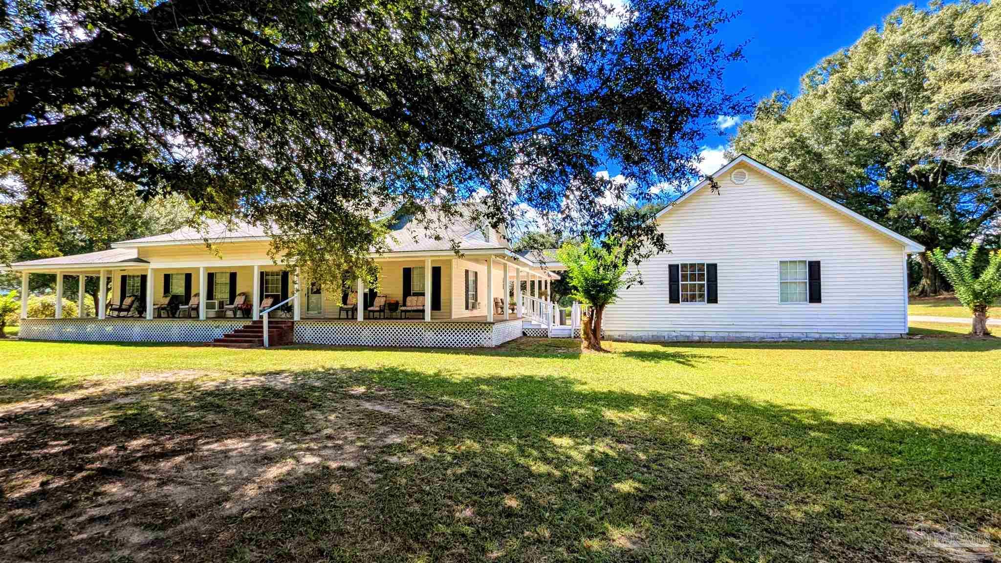 3171 Sam Sullivan Road Millry, AL 36558 - Photo 54 of 72 a front view of a house with swimming pool
