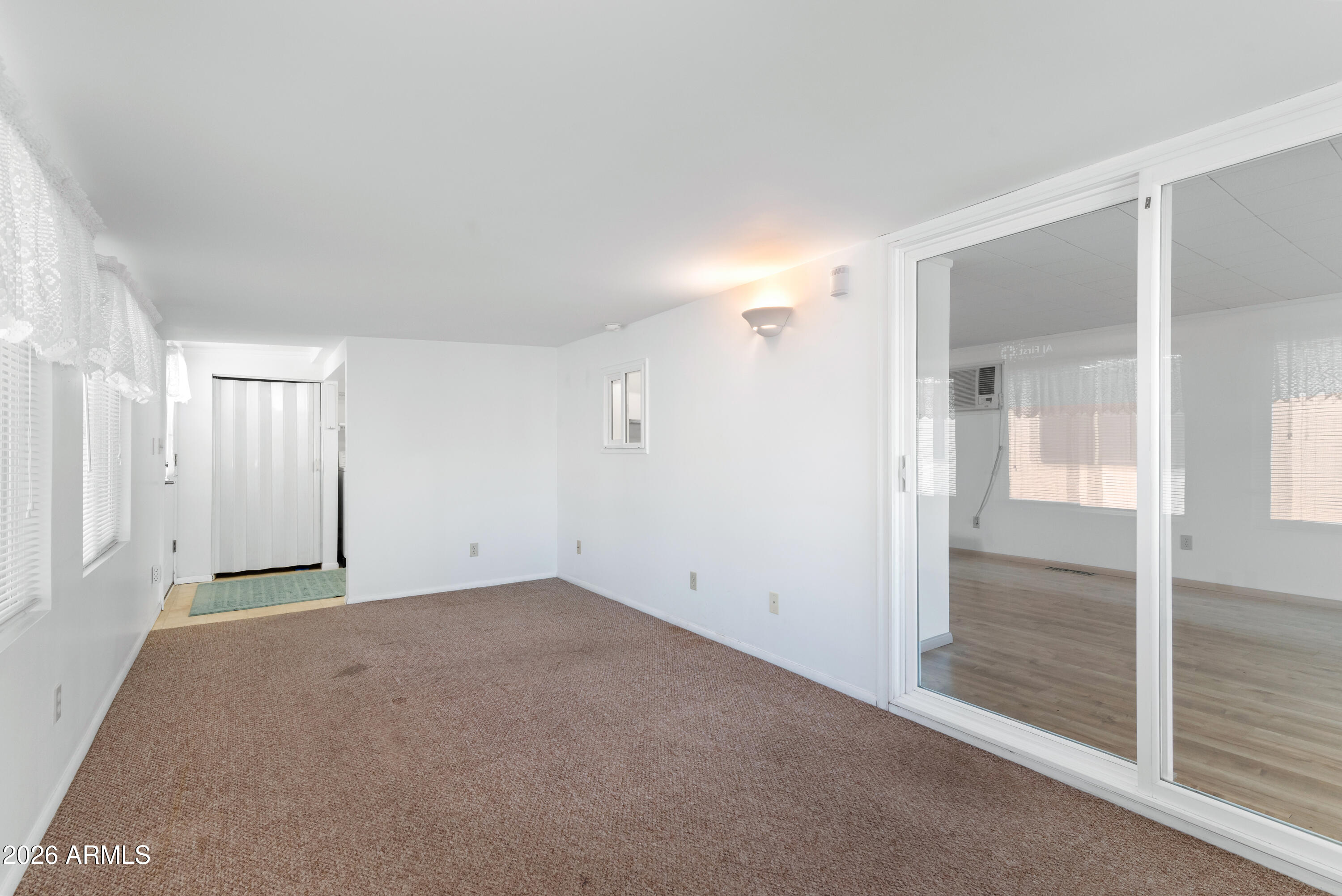 151 South Amulet Avenue Mesa, AZ 85208 - Photo 11 of 29 an empty room with sliding glass door
