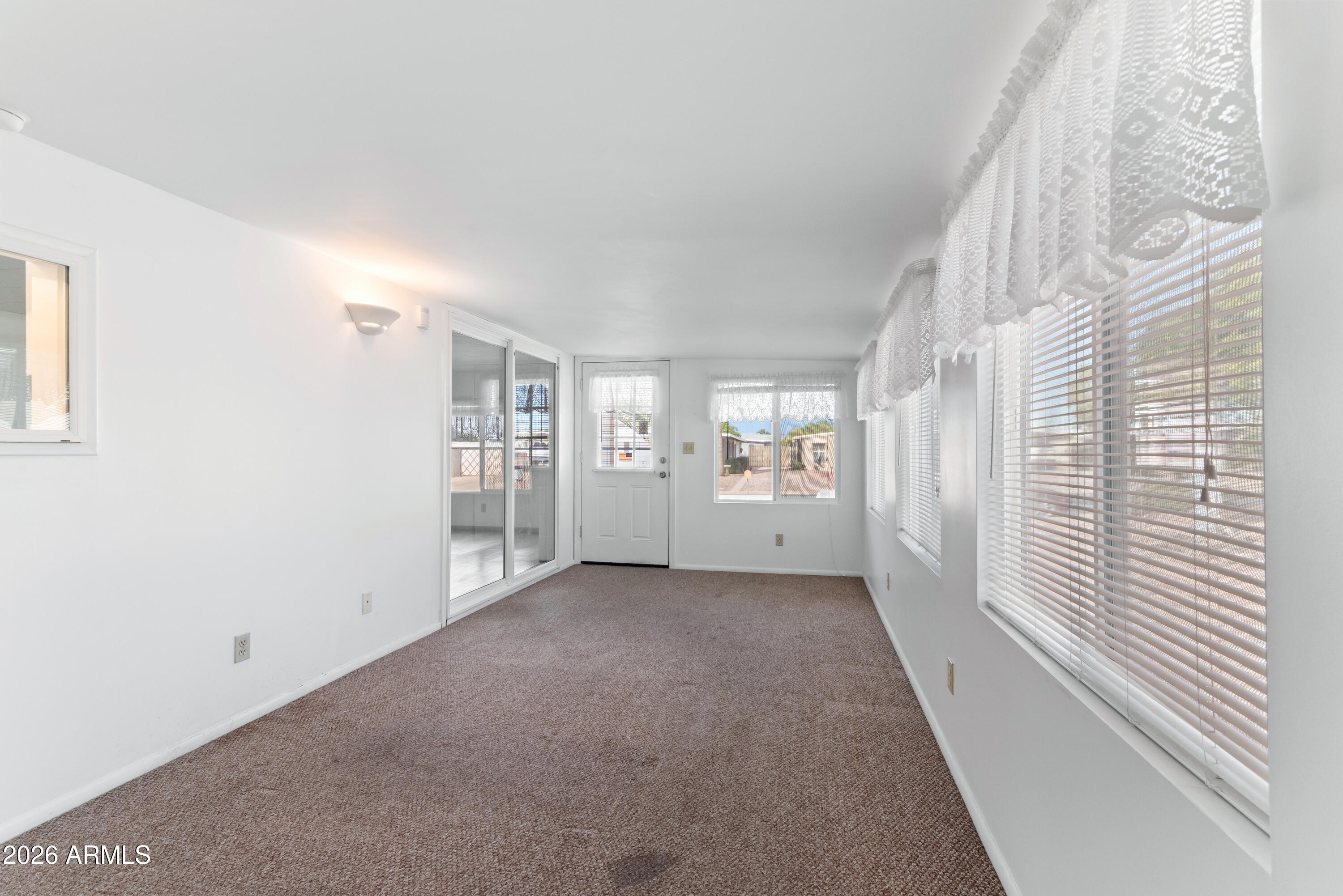 151 South Amulet Avenue Mesa, AZ 85208 - Photo 12 of 29 a view of a big room with windows and kitchen view