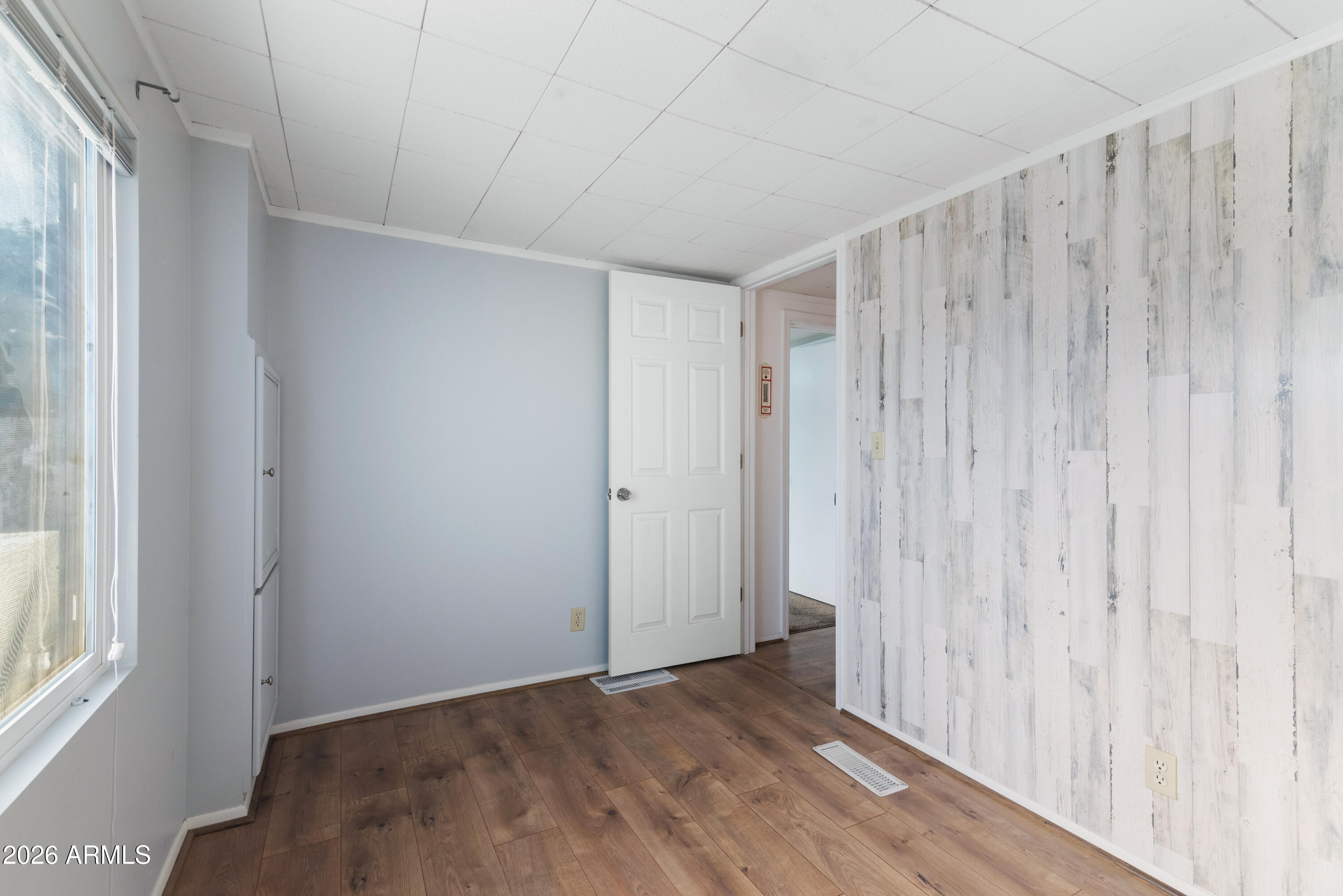 151 South Amulet Avenue Mesa, AZ 85208 - Photo 15 of 29 a view of a room with wooden floor and a window