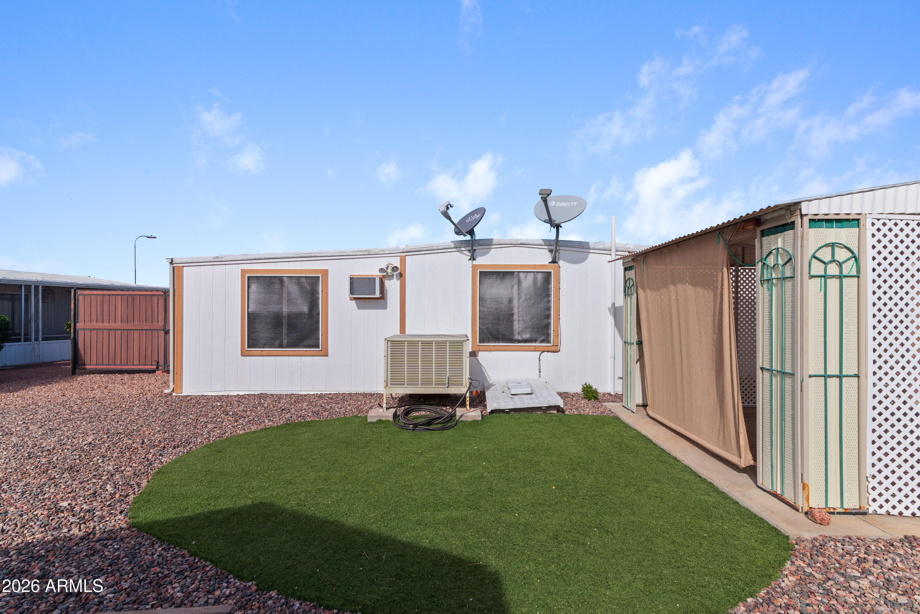 151 South Amulet Avenue Mesa, AZ 85208 - Photo 25 of 29 a front view of a house with a garden and yard