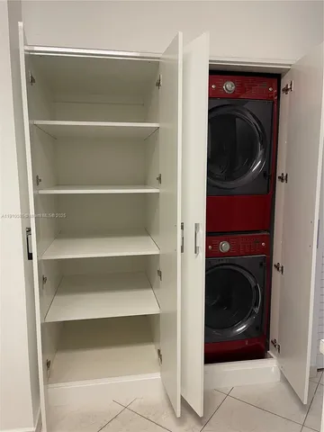 a utility room with washing machine