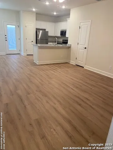 a view of kitchen with stainless steel appliances kitchen island