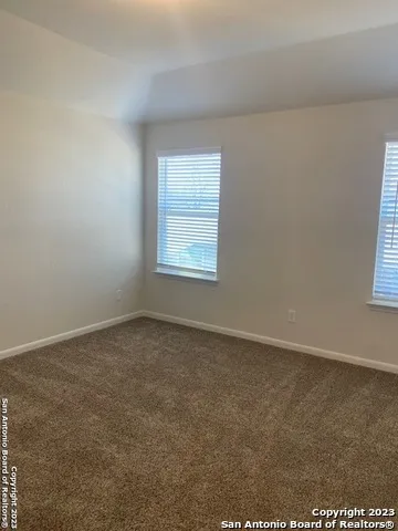 a bathroom with a granite countertop toilet a sink and bathtub