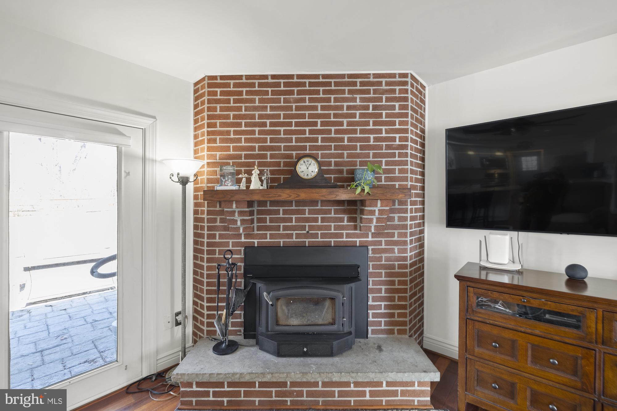 2300 Pin Oak Drive Finksburg, MD 21048 - Photo 15 of 52 a living room with a flat screen tv and a fireplace