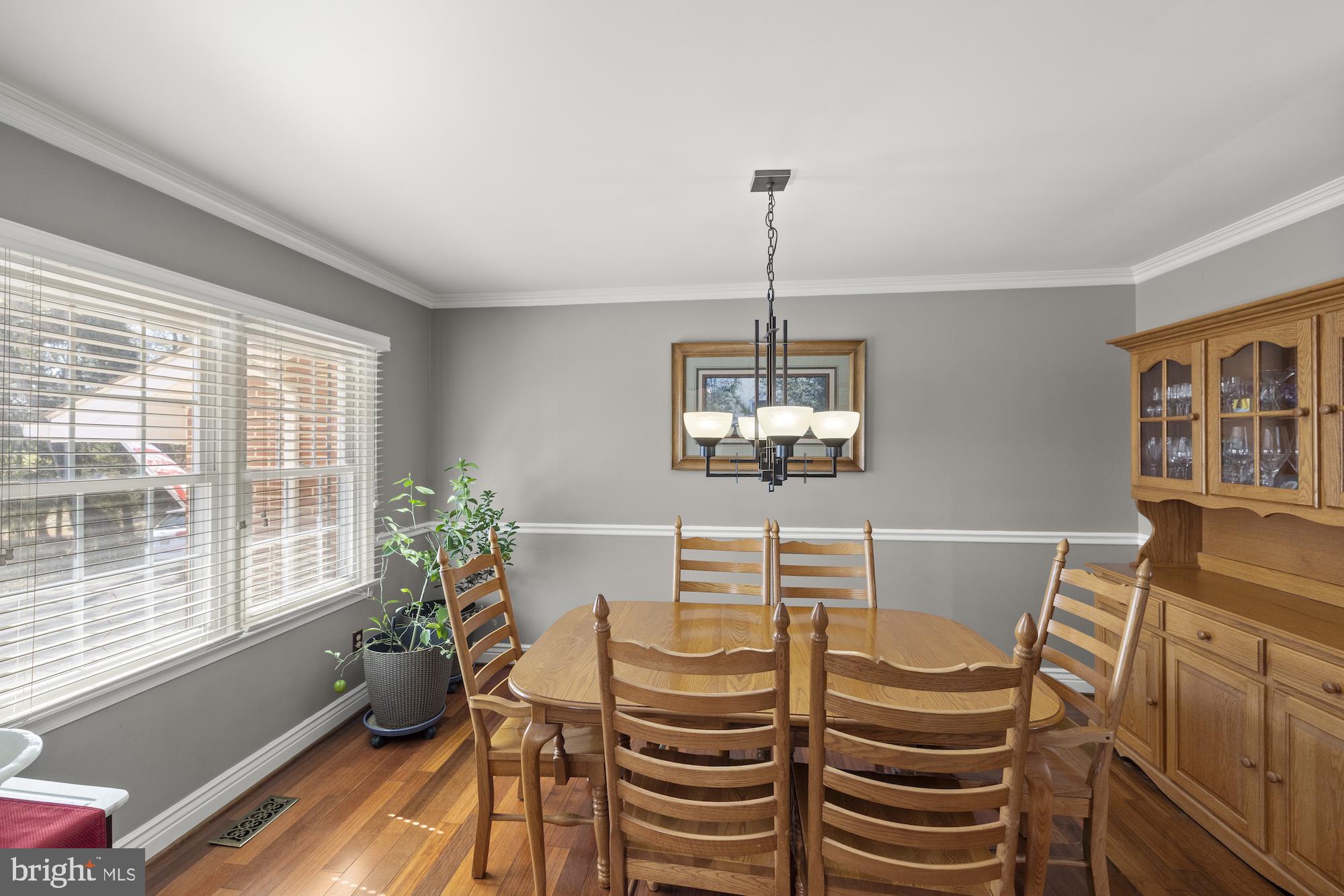 2300 Pin Oak Drive Finksburg, MD 21048 - Photo 16 of 52 a view of a dining room with furniture a livingroom and chandelier
