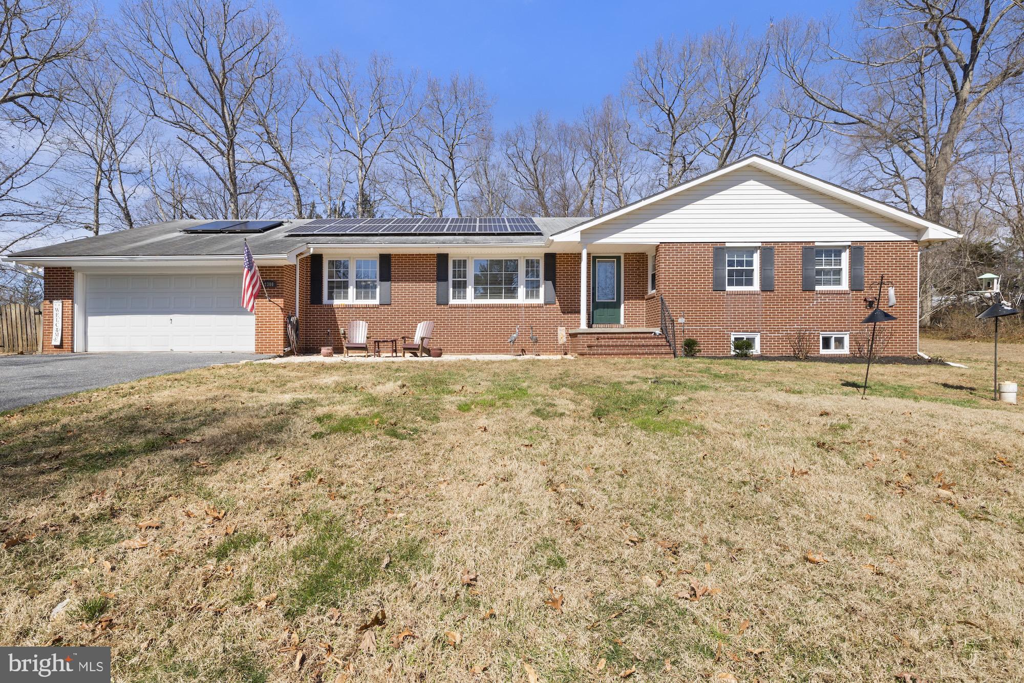 2300 Pin Oak Drive Finksburg, MD 21048 - Photo 2 of 52 a front view of a house with a yard