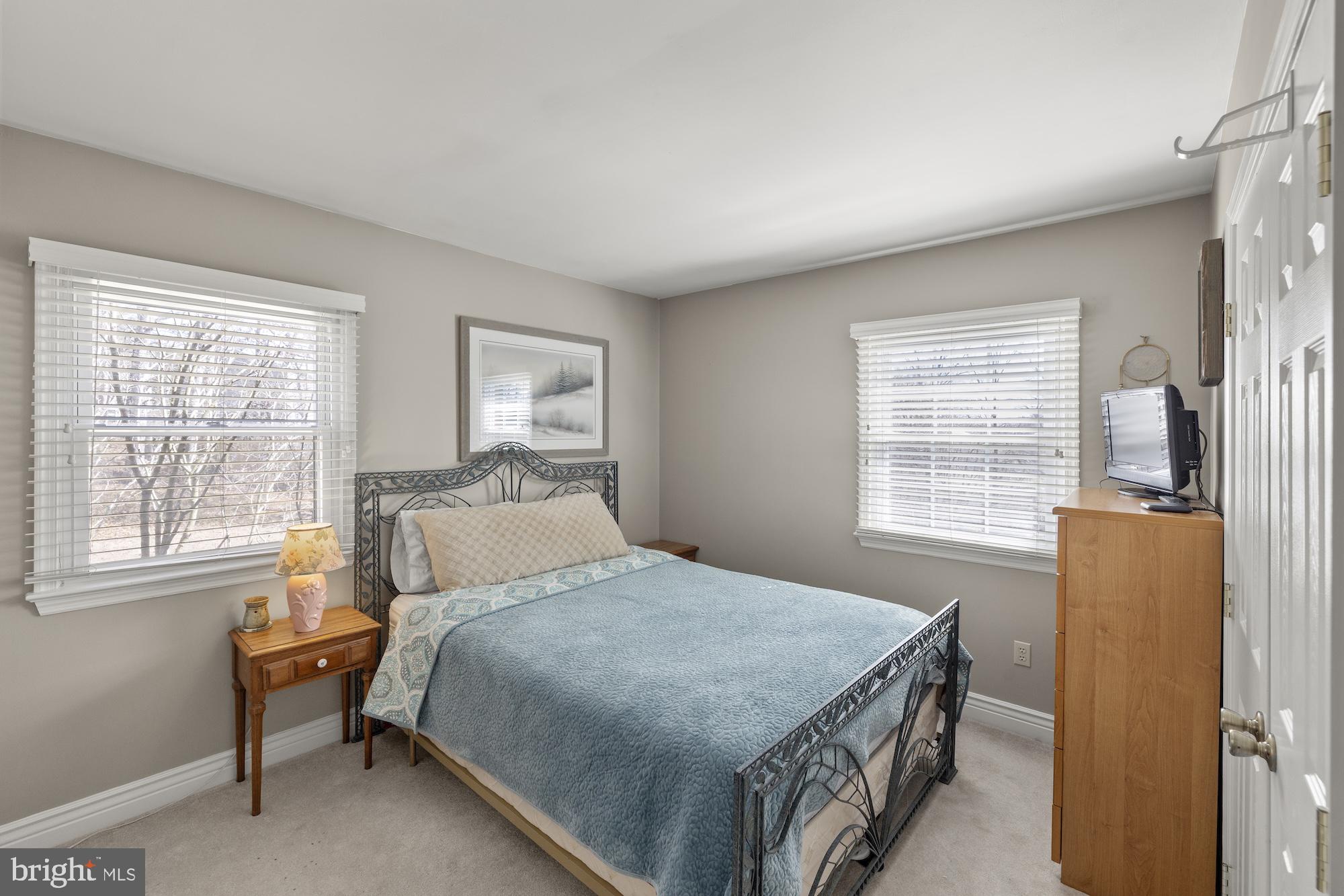 2300 Pin Oak Drive Finksburg, MD 21048 - Photo 30 of 52 a bed sitting in a bedroom next to a window