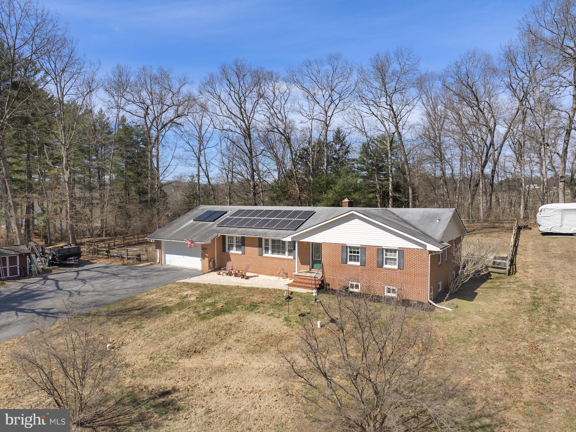 2300 Pin Oak Drive Finksburg, MD 21048 - Photo 46 of 52 a front view of a house with a yard and large tree