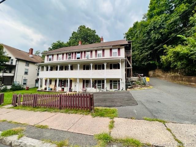 92 West Main Street, Unit 7 Vernon, CT 06066 - Photo 1 of 1 a front view of a house with a yard