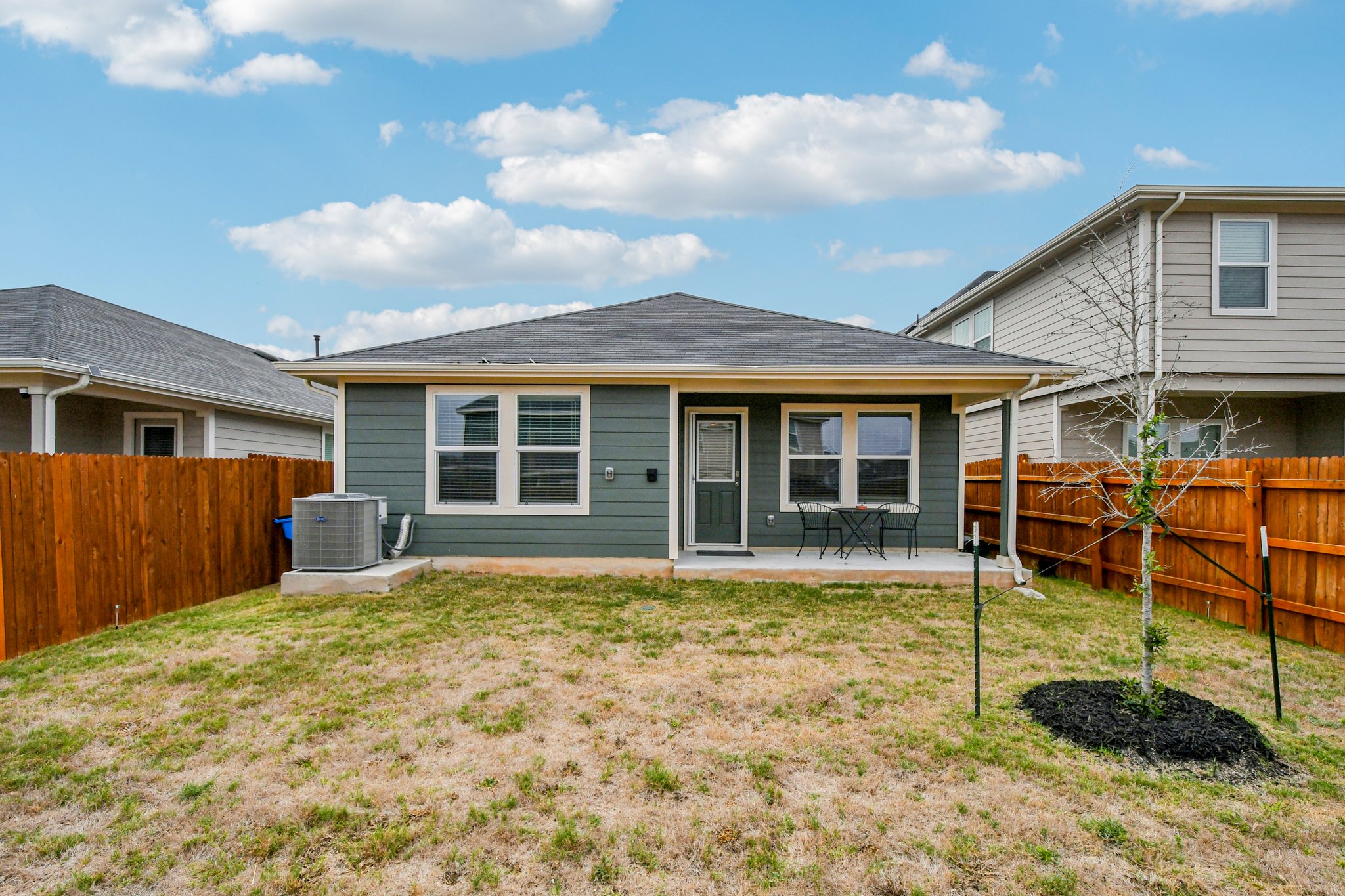 519 Sandringham Loop Kyle, TX 78640 - Photo 30 of 32 Back of property featuring a patio and a fenced backyard