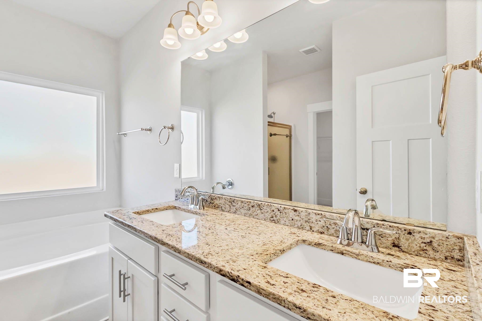 16461 Prado Loop Loxley, AL 36551 - Photo 44 of 78 Bathroom featuring double vanity, a bath, and a stall shower
