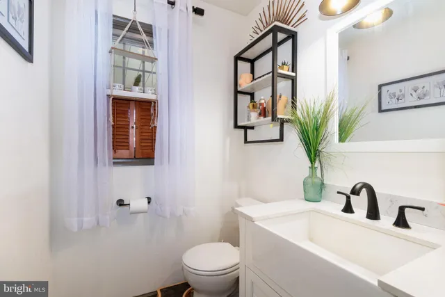 a utility room with cabinets dryer and washer