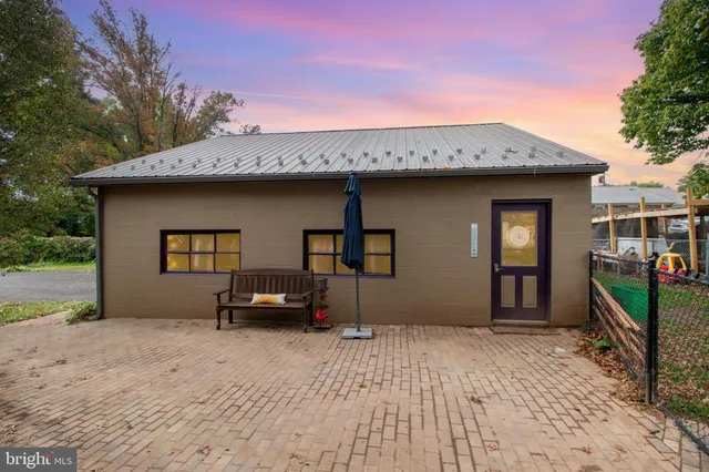 an aerial view of a house with a yard and garden