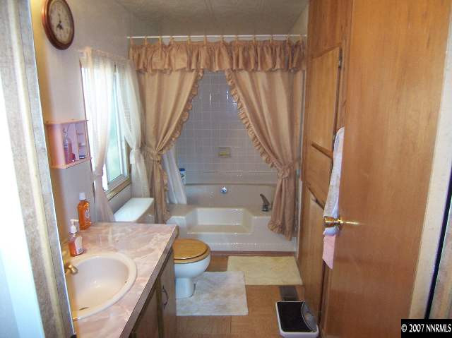 17685 Fantail Street Reno, NV 89508 - Photo 6 of 9 a bathroom with a sink toilet and shower