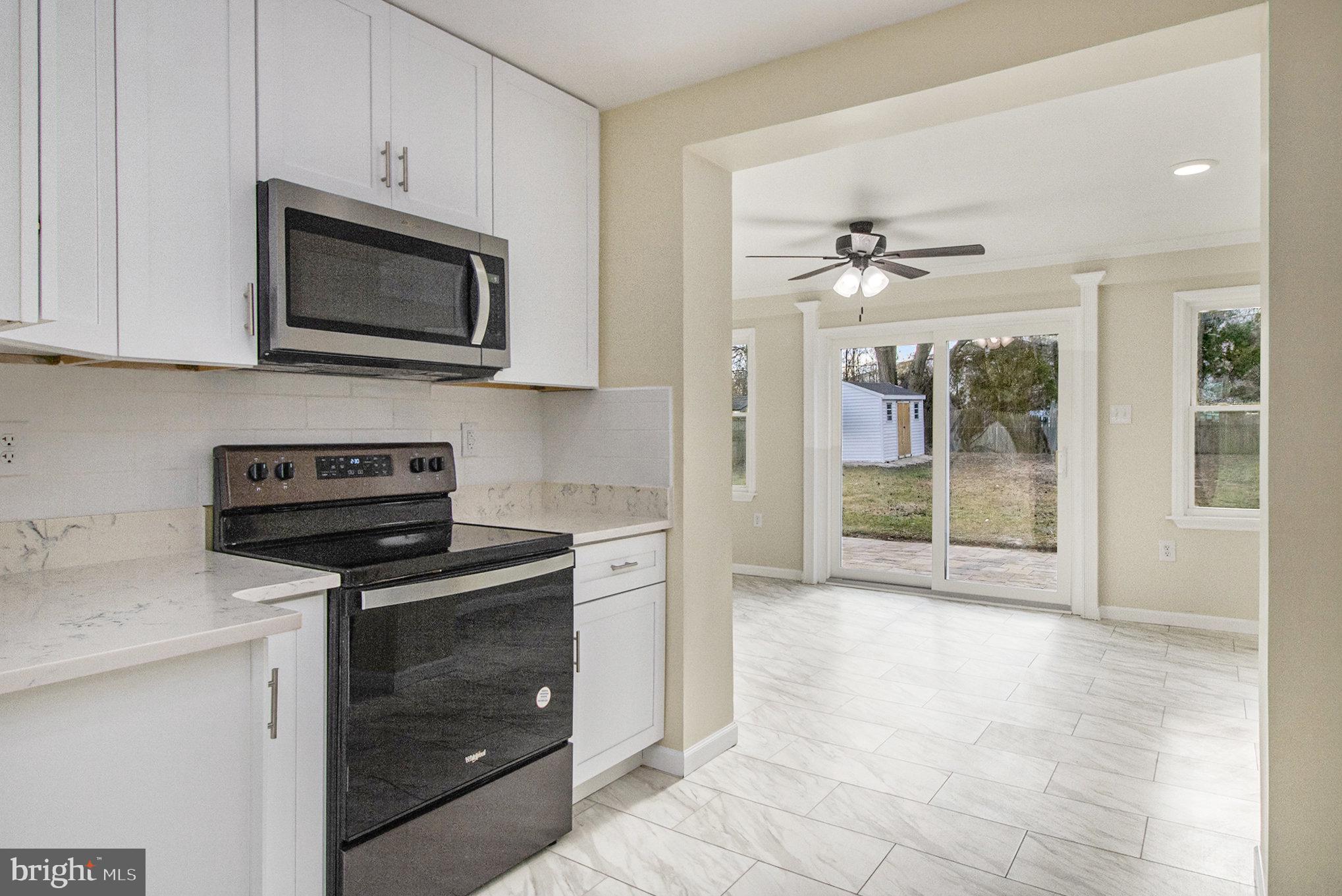711 West County Line Road Hatboro, PA 19040 - Photo 13 of 40 a kitchen with a stove and a microwave