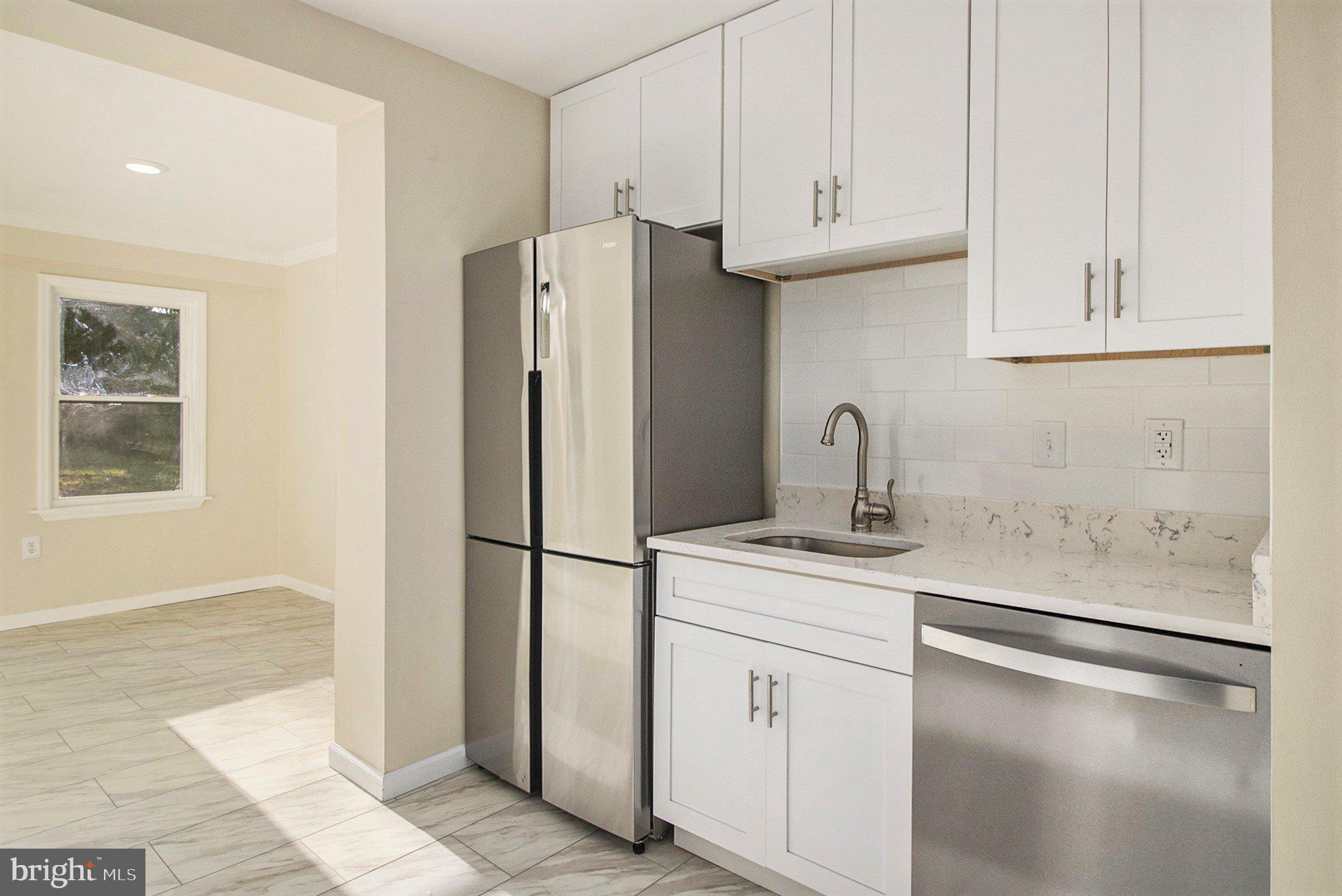 711 West County Line Road Hatboro, PA 19040 - Photo 15 of 40 a kitchen with stainless steel appliances granite countertop a refrigerator sink and cabinets