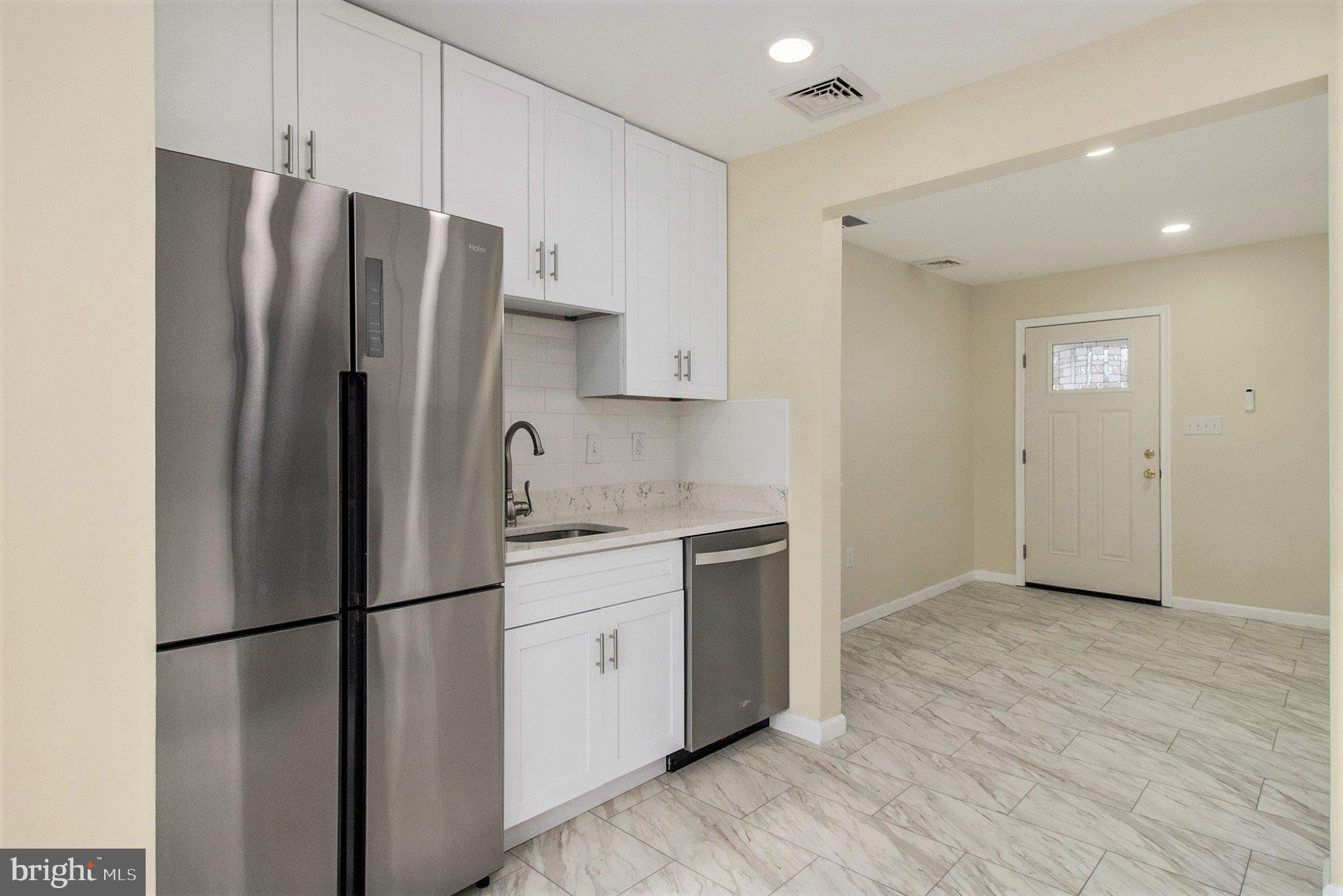 711 West County Line Road Hatboro, PA 19040 - Photo 16 of 40 a kitchen with stainless steel appliances a refrigerator and a sink