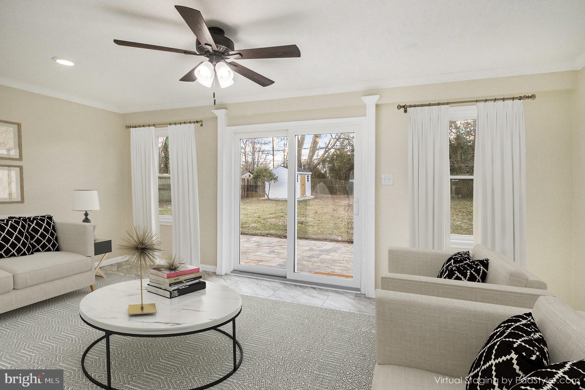 711 West County Line Road Hatboro, PA 19040 - Photo 22 of 40 a living room with furniture and a large window with garden view