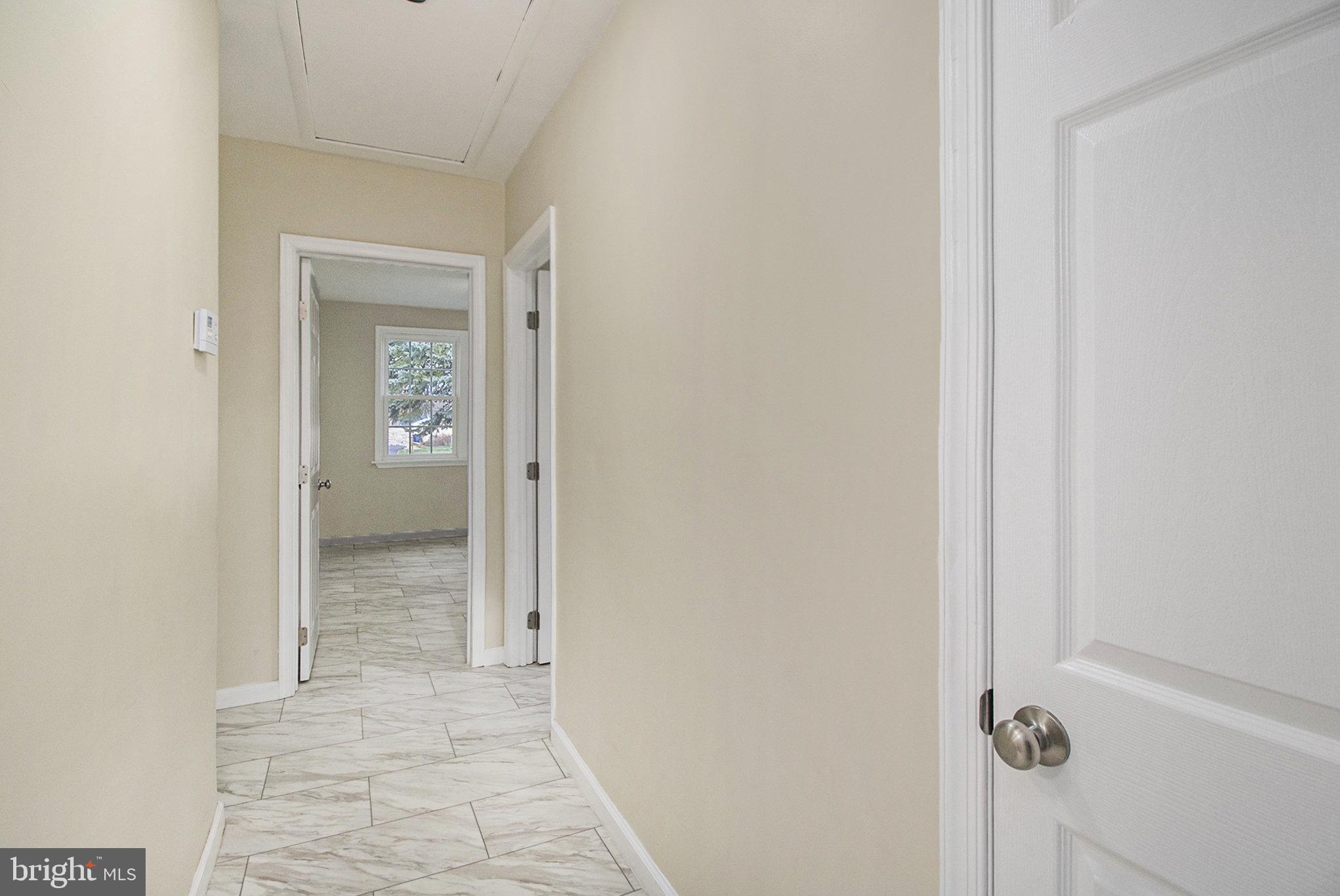 711 West County Line Road Hatboro, PA 19040 - Photo 25 of 40 a view of a bathroom from a hallway