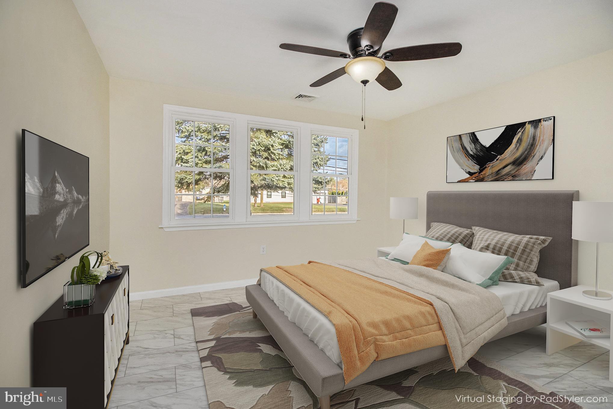 711 West County Line Road Hatboro, PA 19040 - Photo 26 of 40 a bedroom with a bed and a flat screen tv