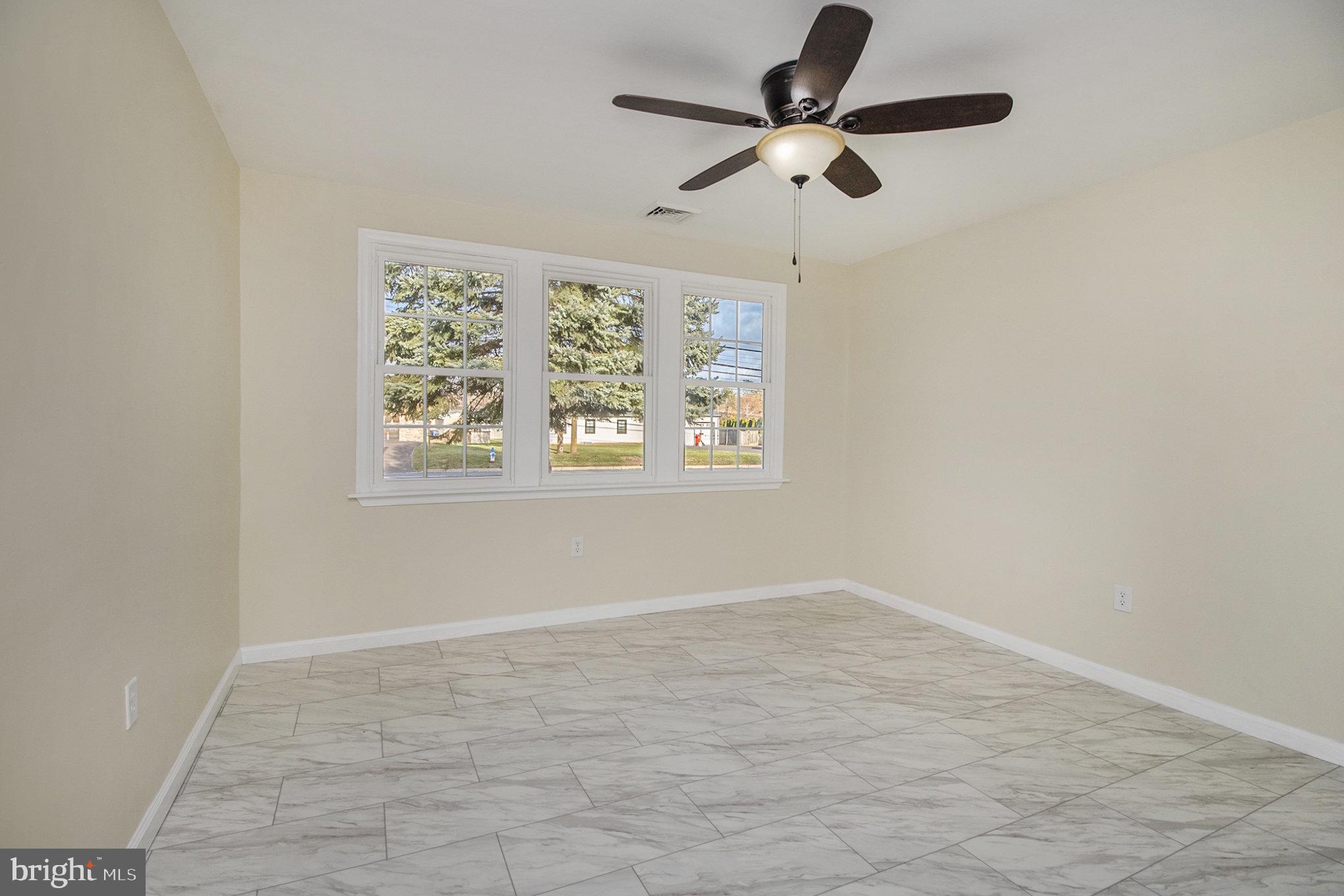 711 West County Line Road Hatboro, PA 19040 - Photo 27 of 40 wooden floor in an empty room with a window